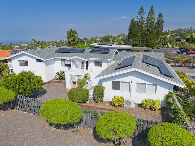 view of front of home featuring solar panels