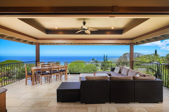 view of patio / terrace featuring an outdoor hangout area, a water view, and ceiling fan