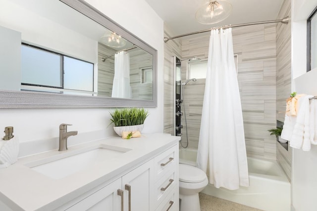 full bathroom featuring toilet, vanity, and shower / bath combo with shower curtain