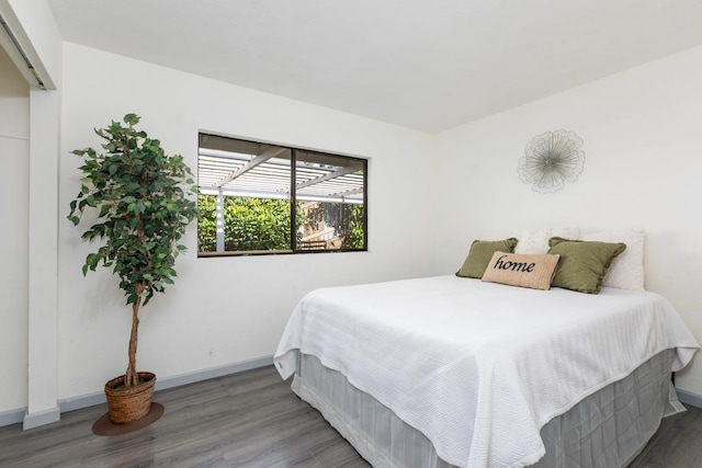 bedroom featuring dark hardwood / wood-style floors