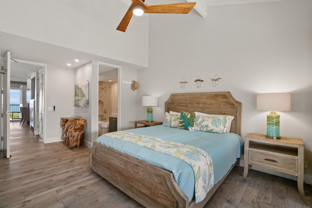 bedroom featuring connected bathroom, ceiling fan, and hardwood / wood-style flooring