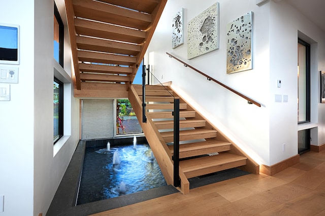 stairway with wood-type flooring