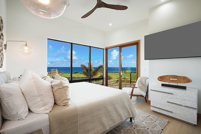 bedroom with ceiling fan, light hardwood / wood-style floors, and access to exterior