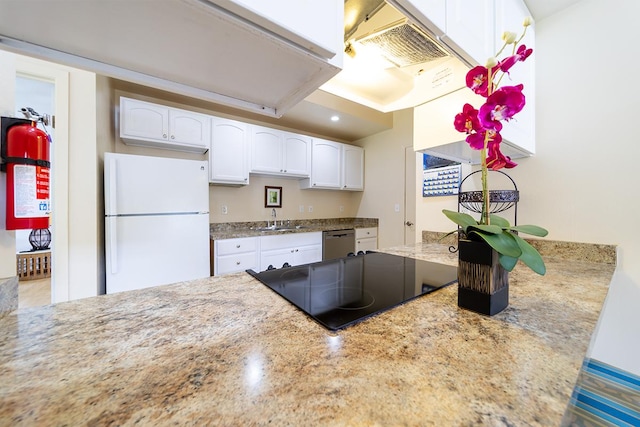 kitchen with sink, dishwasher, white cabinets, and white fridge