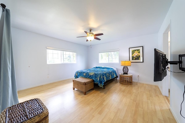 bedroom featuring ceiling fan and light hardwood / wood-style flooring