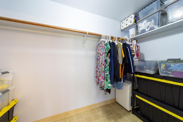 spacious closet featuring washer / clothes dryer