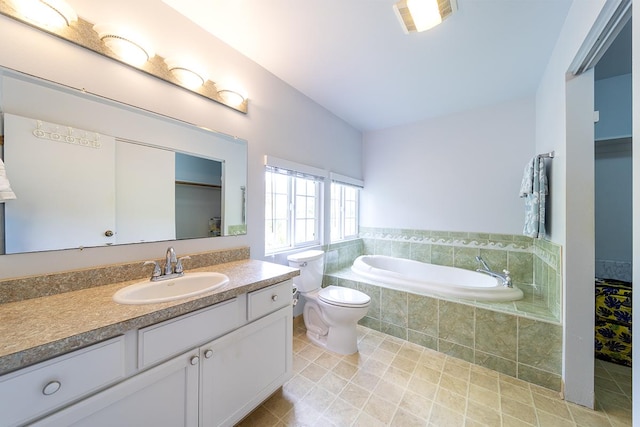 bathroom featuring lofted ceiling, toilet, vanity, a relaxing tiled tub, and tile patterned flooring