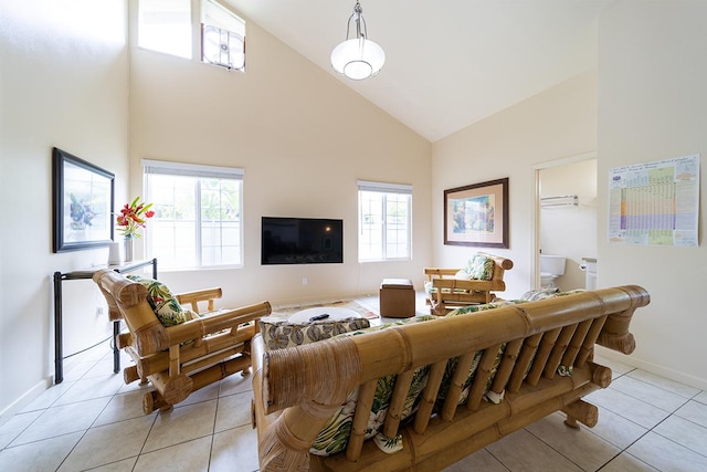 living room with high vaulted ceiling and light tile patterned floors