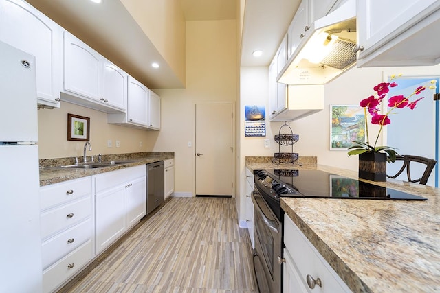 kitchen featuring electric stove, sink, white cabinetry, stainless steel dishwasher, and white fridge