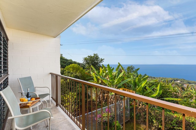 balcony featuring a water view