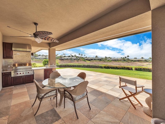 view of patio featuring ceiling fan, a grill, area for grilling, and sink