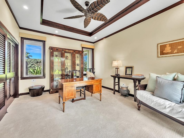 home office with ceiling fan, ornamental molding, and light colored carpet