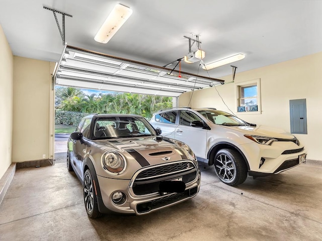 garage featuring electric panel and a garage door opener