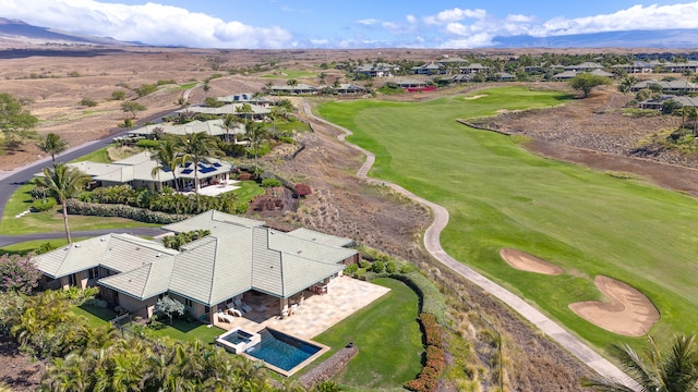 birds eye view of property with a mountain view