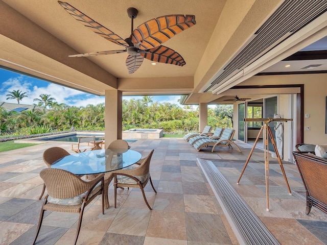 view of patio / terrace with ceiling fan and a swimming pool with hot tub