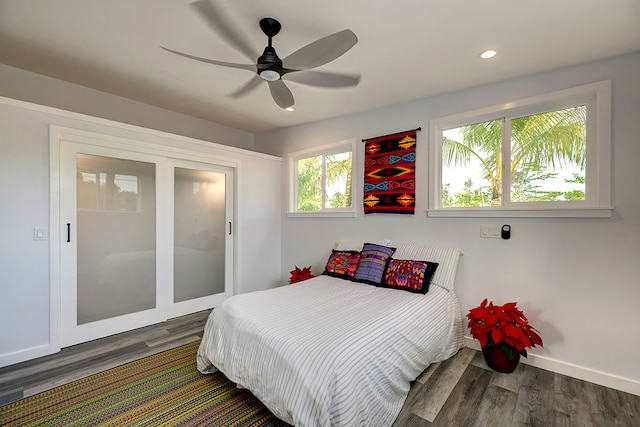 bedroom with hardwood / wood-style floors and ceiling fan