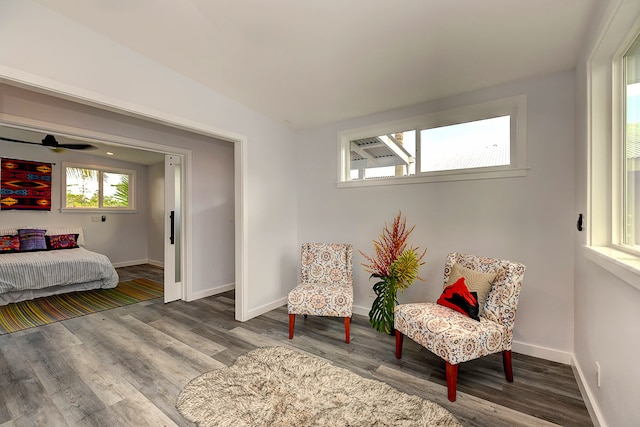 sitting room featuring ceiling fan and hardwood / wood-style flooring