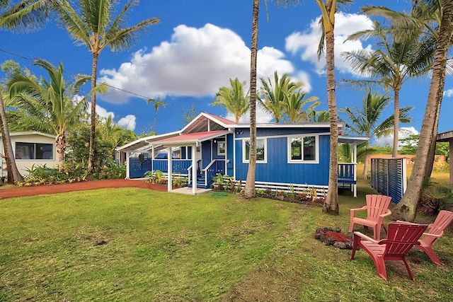 view of front of house with a porch and a front lawn