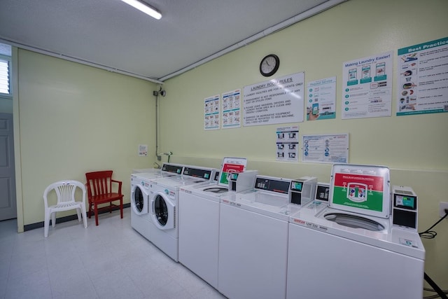 washroom featuring washer and clothes dryer