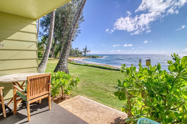 view of yard with a patio area and a water view