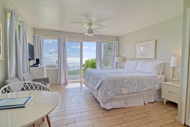 bedroom with access to exterior and ceiling fan