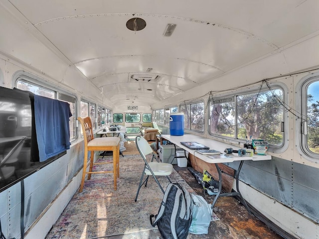 sunroom / solarium featuring vaulted ceiling