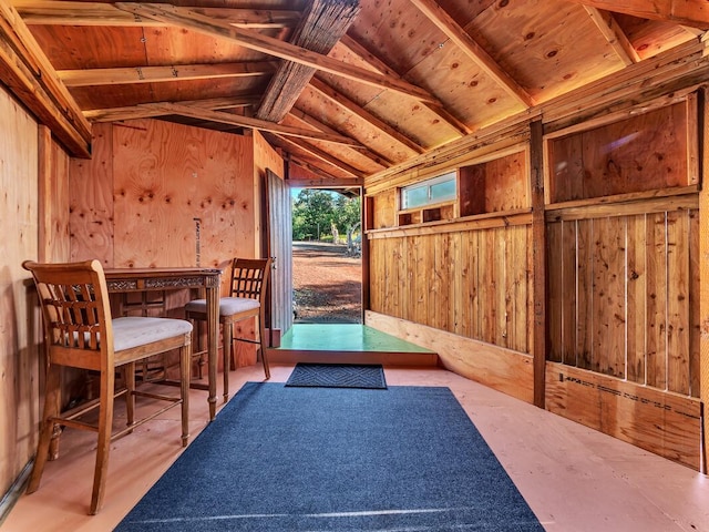 sunroom with vaulted ceiling with beams and wooden ceiling