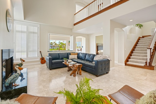 living room featuring a high ceiling