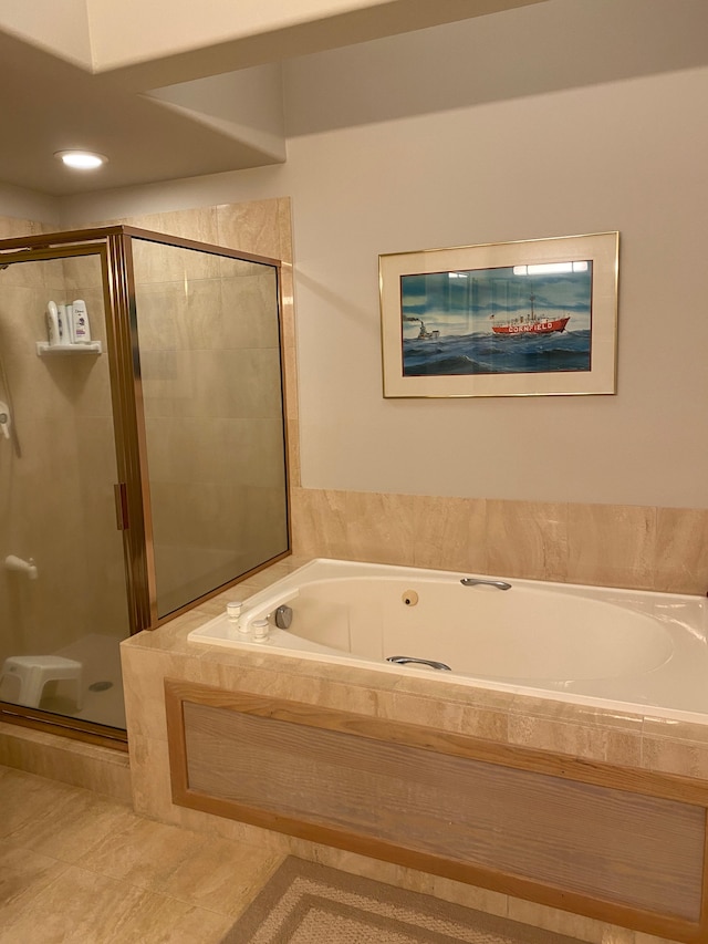 bathroom featuring plus walk in shower and tile patterned floors