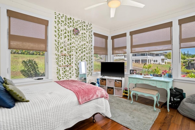 bedroom featuring hardwood / wood-style flooring and ceiling fan