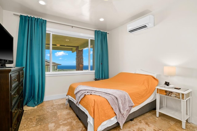 bedroom featuring a wall mounted AC