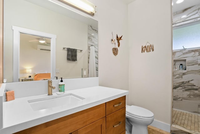 bathroom featuring a tile shower, vanity, toilet, and a wall mounted AC