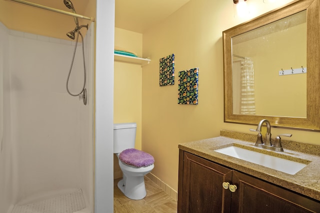 bathroom with a shower with shower curtain, tile patterned floors, vanity, and toilet