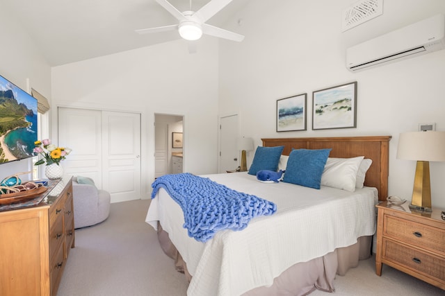 bedroom featuring ceiling fan, a wall mounted air conditioner, high vaulted ceiling, light colored carpet, and a closet