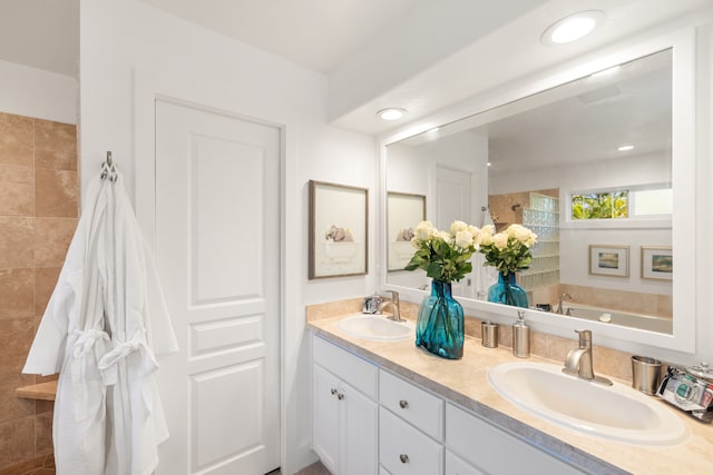 bathroom featuring a bathing tub and vanity