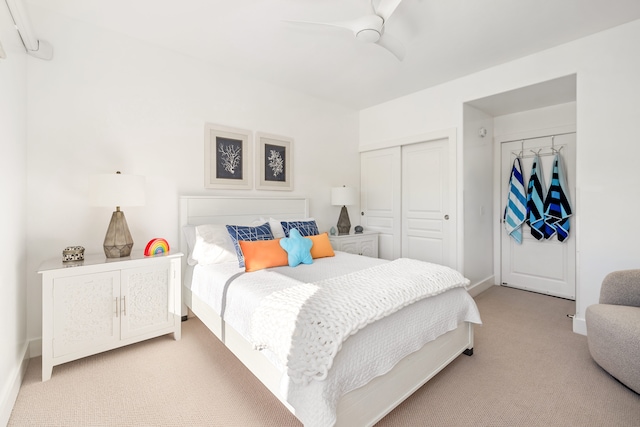 carpeted bedroom featuring ceiling fan