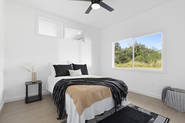 bedroom featuring light hardwood / wood-style flooring and ceiling fan