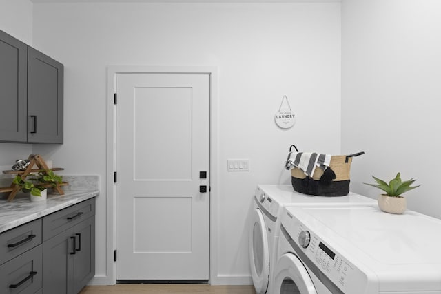 laundry area with cabinets and washer and dryer