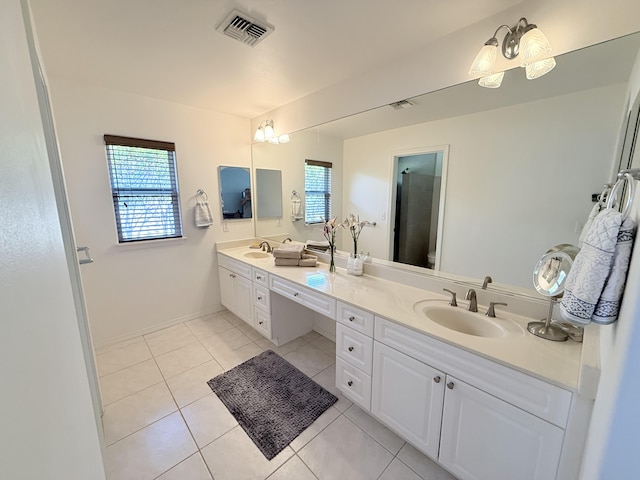 bathroom featuring tile patterned flooring and vanity