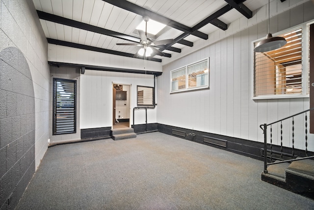 interior space with ceiling fan and carpet floors