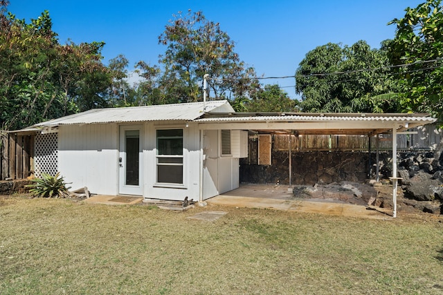 view of outbuilding featuring a yard