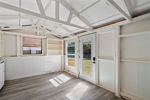 unfurnished sunroom with lofted ceiling