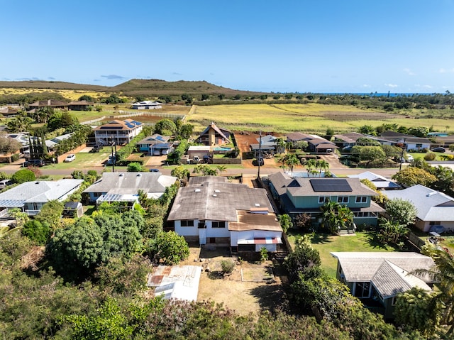 birds eye view of property with a mountain view