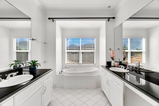 bathroom with tile patterned flooring, vanity, and a healthy amount of sunlight