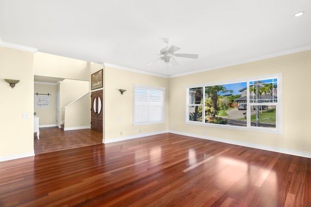 unfurnished living room with dark hardwood / wood-style floors, ceiling fan, and ornamental molding