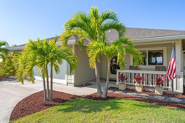 exterior space with a porch and a front lawn