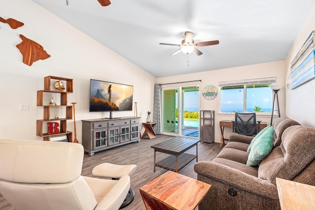 living room featuring hardwood / wood-style flooring, vaulted ceiling, and ceiling fan