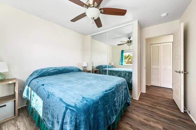 bedroom with ceiling fan, a closet, and dark hardwood / wood-style floors