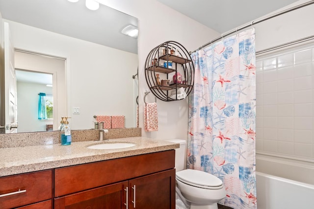 full bathroom with vanity, toilet, and shower / bath combo with shower curtain