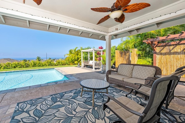 view of swimming pool with a pergola, ceiling fan, a patio, and an outdoor hangout area